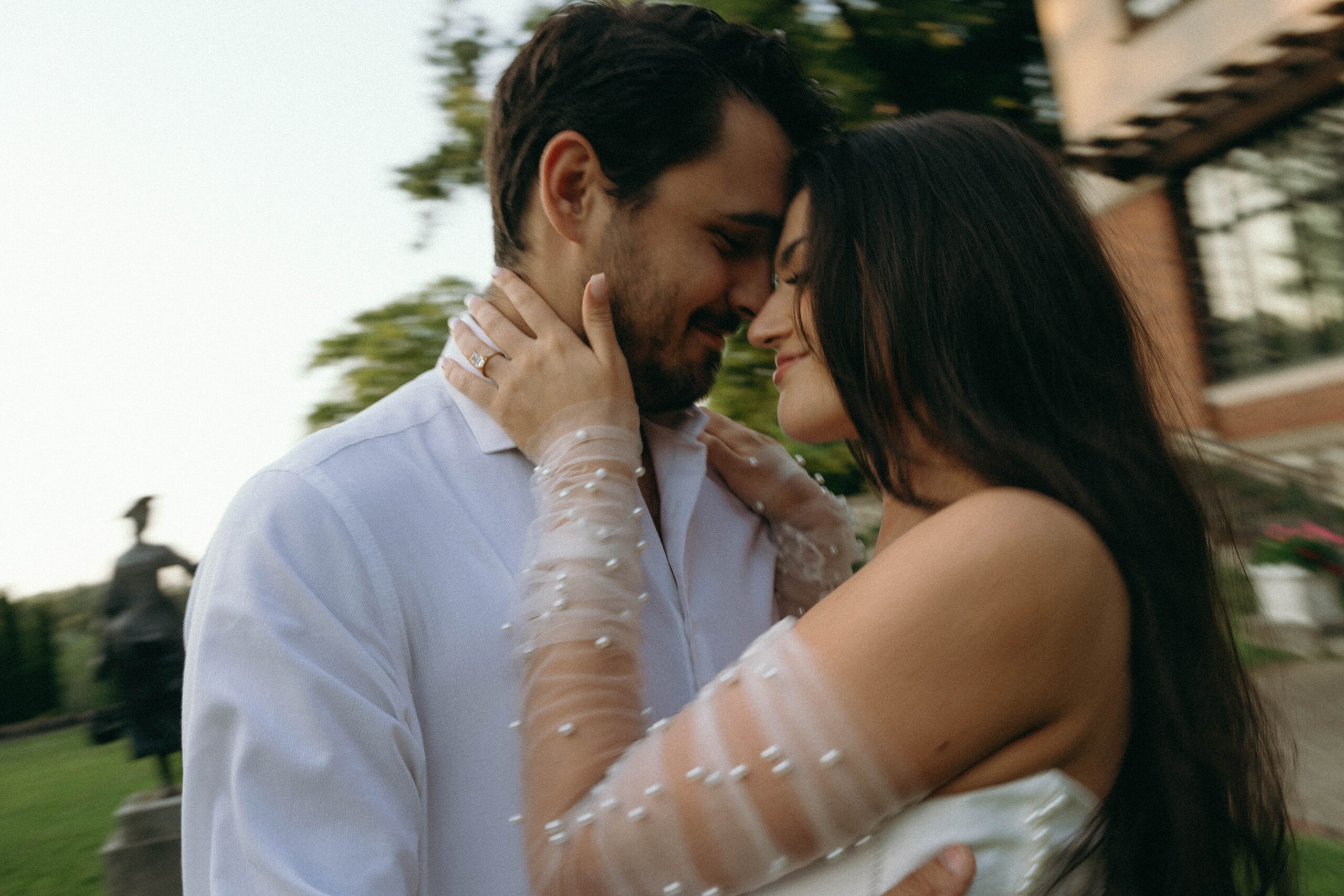 A professional couples engagement photographer capturing a beautiful moment of a couple during their engagement session, showcasing love and joy on a special day.